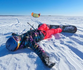 People lying in the snow Stock Photo
