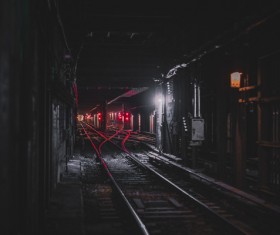 Railway station in dark tunnel Stock Photo