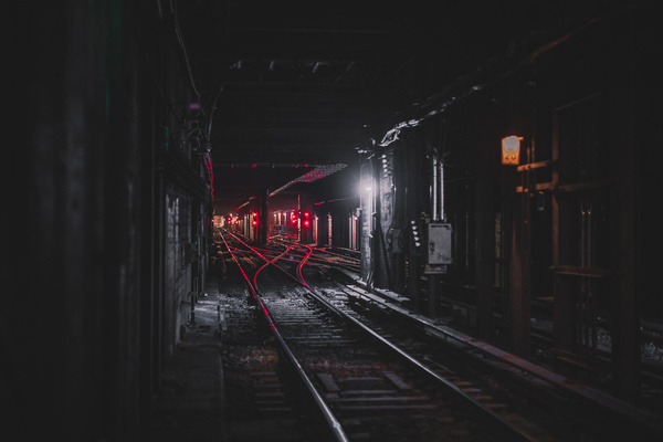 Railway station in dark tunnel Stock Photo