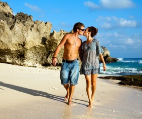 Romantic lovers walking on the beach Stock Photo 01