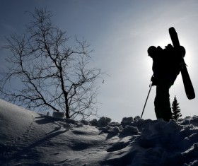 Skier on sunset snow Stock Photo