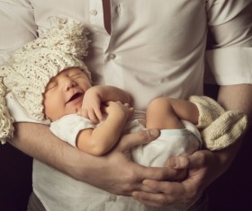 Sleeping baby in his arms Stock Photo