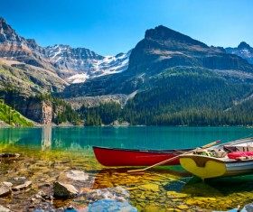 Small boat on calm lake Stock Photo