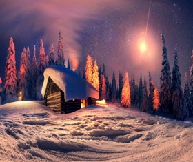 Snow-covered cottage in the forest Stock Photo