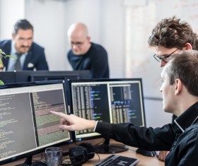 Staff compiled code analysis Stock Photo