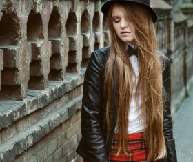 Standing next to the ancient building photographed girl Stock Photo