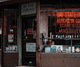 Store decorated with neon lights on glass window Stock Photo