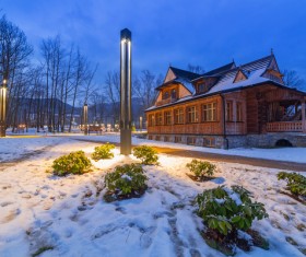 Streetlights and houses at dusk Stock Photo