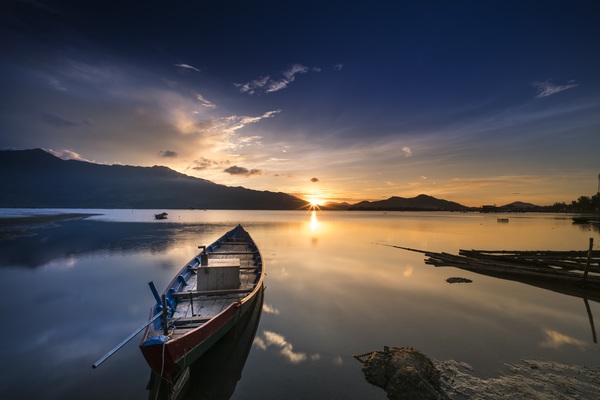 Sunset lake boat landscape Stock Photo