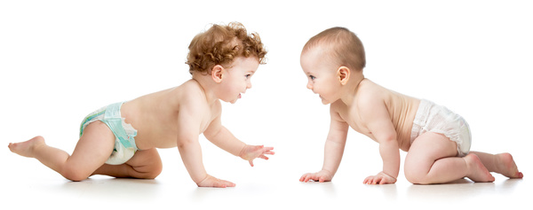 Two crawling babies Stock Photo