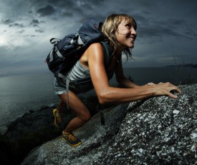 Woman climbing by hand Stock Photo