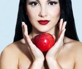 Woman holding a red apple Stock Photo