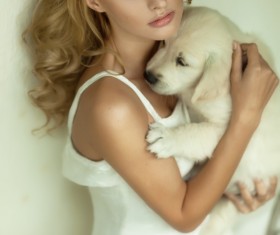 Woman holding pet dog Stock Photo 01