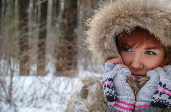 Woman in fur coat outdoors in winter Stock Photo