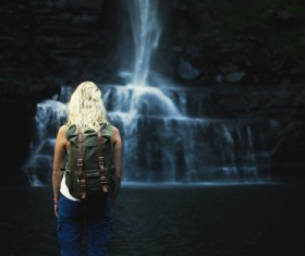 Woman looking at mountains and rivers landscape Stock Photo