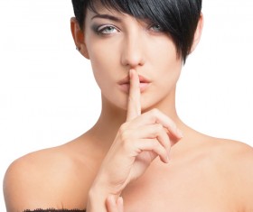 Woman putting finger on lips Stock Photo 01
