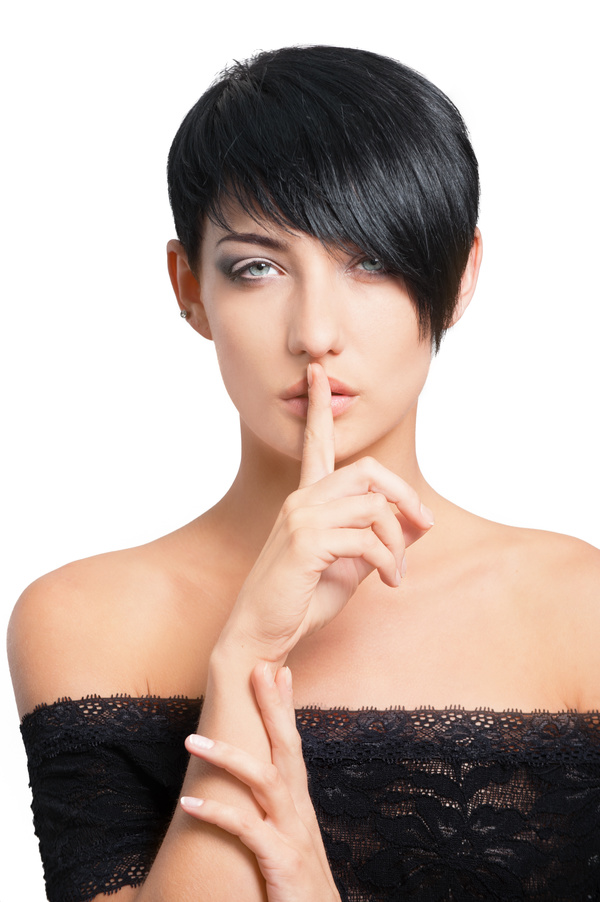 Woman putting finger on lips Stock Photo 01