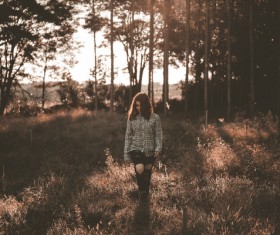 Woman walking on the grass Stock Photo