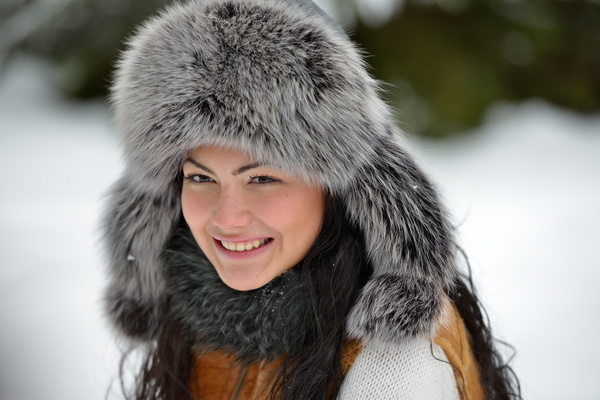Woman wearing cotton cap outdoors in winter Stock Photo 02