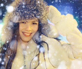 Woman wearing cotton cap outdoors in winter Stock Photo 07