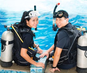 Young Lovers wearing wetsuit Stock Photo