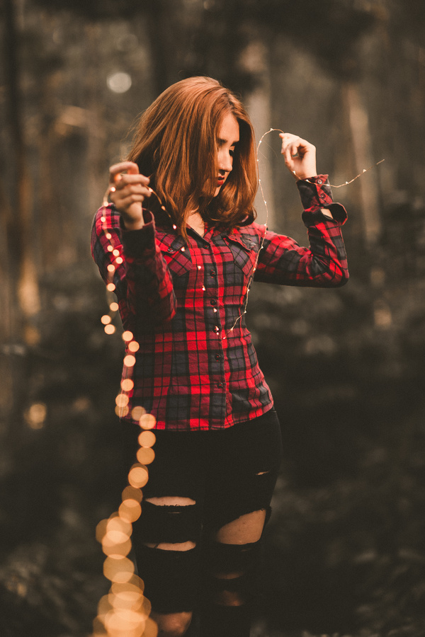 Young girl holding shiny lights Stock Photo