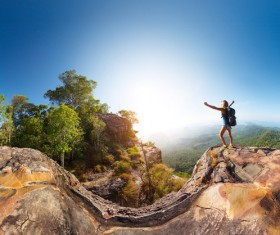 happy woman on the top of the hill Stock Photo