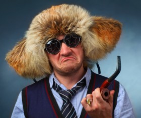 man wearing fur hat interesting expression Stock Photo