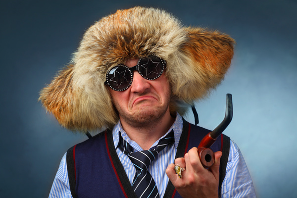 man wearing fur hat interesting expression Stock Photo