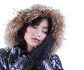 wearing down jacket Woman Stock Photo