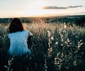 woman relaxing on wild flowers meadow Stock Photo