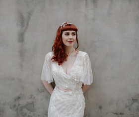 young woman in white dress Stock Photo