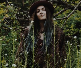 young woman posing in wild flowers field Stock Photo