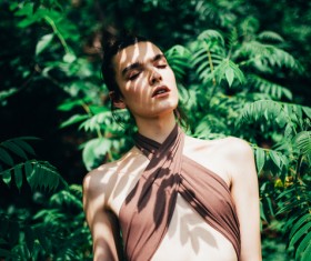 Attractive young woman posing in nature Stock Photo