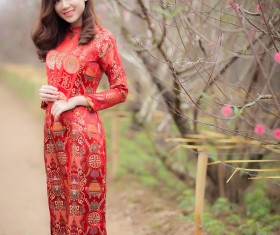 Beautiful asian girl in red festive costume Stock Photo
