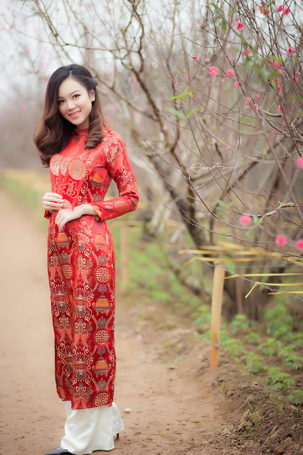 Beautiful asian girl in red festive costume Stock Photo
