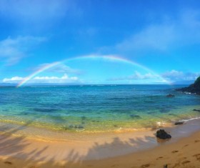 Beautiful rainbow over the sea Stock Photo