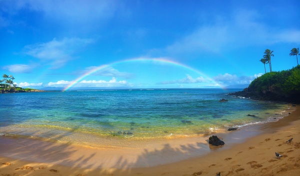 Beautiful rainbow over the sea Stock Photo