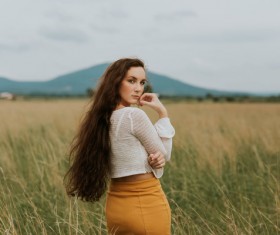 Beautiful woman posing on meadow Stock Photo
