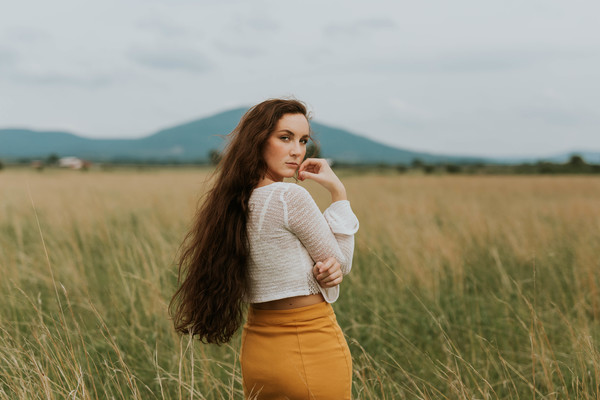 Beautiful woman posing on meadow Stock Photo