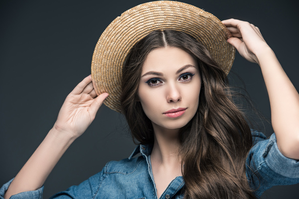 Beautiful woman wearing cowboy suit wearing straw hat Stock Photo 05