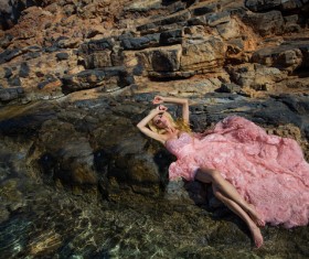 Blonde in pink dress by the sea Stock Photo 05