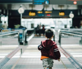Boy running in airport Stock Photo