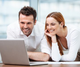 Business partners working on laptop Stock Photo 02