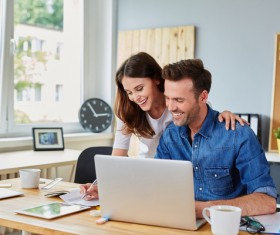 Business partners working on laptop Stock Photo 03