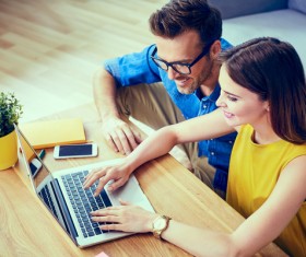 Business partners working on laptop Stock Photo 04