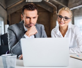 Business partners working on laptop Stock Photo 05
