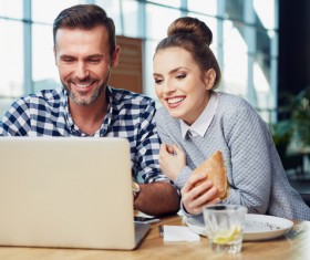 Business partners working on laptop Stock Photo 06
