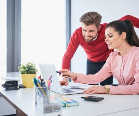Business partners working on laptop Stock Photo 07