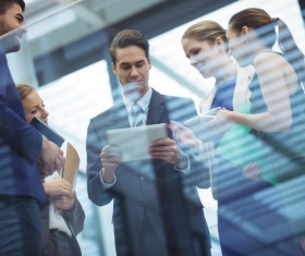 Business people using Tablet PC Stock Photo 01